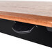 A close up of the black wooden surface of a Luxor Pneumatic Adjustable Height Stand Up Desk.