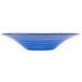 An American Metalcraft Glacier Blue glass bowl with a wavy design on the surface.