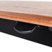 A Luxor stand up desk with a black and wood surface and black pneumatic handle.