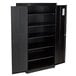 A black metal HON storage cabinet with open doors and shelves.