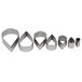 A set of six Ateco stainless steel fluted teardrop cookie cutters in different shapes.