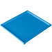 A sky blue cast aluminum rectangular cooling platter on a table.