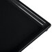A close-up of a black Tablecraft rectangular cooling platter.
