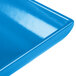 A close-up of a blue Tablecraft cast aluminum platter with a flared rectangular surface.