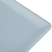A close-up of a gray rectangular cast aluminum cooling platter.