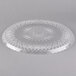 A clear plastic Fineline Catering tray with a scalloped design.