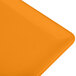 An orange cast aluminum Tablecraft rectangular cooling platter with a close-up of the orange surface.