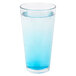A Libbey stackable mixing glass filled with blue liquid and ice.