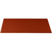 A rectangular copper cast aluminum cooling platter with a red surface and a logo on it.