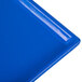 A Tablecraft cobalt blue cast aluminum rectangular platter with a textured surface.
