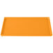 A rectangular orange cast aluminum cooling platter.