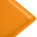 An orange rectangular cast aluminum cooling platter with a white background.
