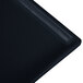 A black cast aluminum half long rectangular cooling platter with blue speckles.