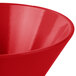 A close up of a red Tablecraft cast aluminum serving bowl.
