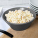 A Tablecraft granite cast aluminum serving bowl filled with macaroni salad.