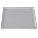 A natural cast aluminum rectangular cooling platter with a white border.