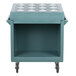 A blue plastic Cambro cutlery rack for a cart with wheels.