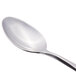 A Reed & Barton stainless steel dessert spoon with a silver handle.