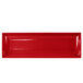A red rectangular platter with white edges.
