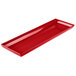 A red Tablecraft cast aluminum rectangular platter with a handle.