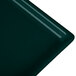 A close-up of a dark green Tablecraft cast aluminum rectangular cooling platter.