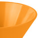 An orange Tablecraft round cast aluminum serving bowl.