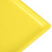A yellow rectangular cast aluminum platter with a white edge.