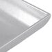 A natural aluminum rectangular platter with flared edges.