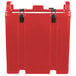 A red plastic container with black handles.