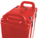 A red plastic container with a handle.