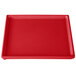 A red rectangular Tablecraft cooling platter with a white surface.