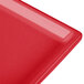 A red cast aluminum Tablecraft rectangular cooling platter.