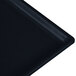 A close-up of a Tablecraft Midnight with Blue Speckle rectangular cast aluminum cooling platter with a black surface.