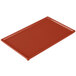 A red rectangular Tablecraft copper cast aluminum cooling platter.