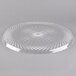 A clear plastic Fineline scalloped catering tray with a circular pattern on it.