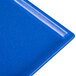 A blue rectangular metal Tablecraft cooling platter with white specks.