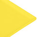 A yellow rectangular Tablecraft cast aluminum cooling platter.