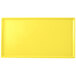 A yellow rectangular cast aluminum Tablecraft cooling platter.
