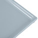 A close-up of a gray Tablecraft rectangular cooling platter.