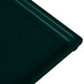A Tablecraft hunter green and white speckled metal platter on a black surface.