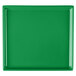A green rectangular cast aluminum cooling platter on a white surface.