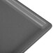 A close-up of a grey Tablecraft granite cast aluminum rectangular cooling platter.