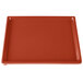 A red rectangular Tablecraft copper cast aluminum cooling platter with a white border.