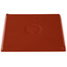 A copper cast aluminum rectangular cooling platter with a red cover.