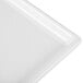 A close-up of a white Tablecraft cast aluminum rectangular cooling platter.
