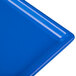 A cobalt blue Tablecraft cast aluminum rectangular cooling platter.