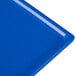 A close-up of a Tablecraft cobalt blue cast aluminum rectangular cooling platter.