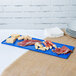 A blue rectangular Tablecraft platter with meat and cheese on it.