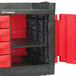 A black Rubbermaid TradeMaster cart with drawers and cabinet.