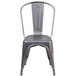 A Flash Furniture metal restaurant chair with a vertical slat back.